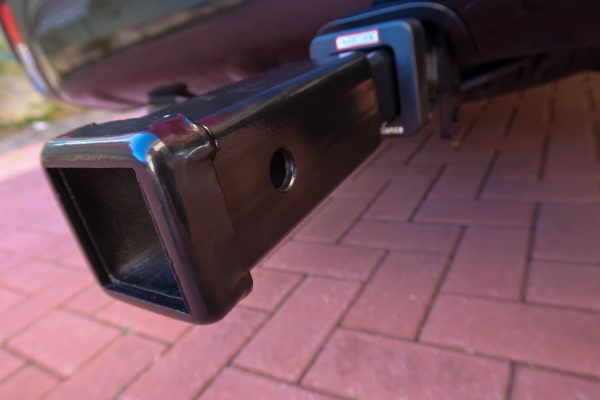 Angled view of hitch extender attached to vehicle